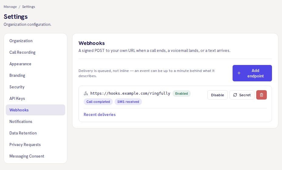 The Webhooks screen in the portal’s settings: one endpoint, enabled, sending Call completed and SMS received events, with Disable, Secret and delete buttons and a link to recent deliveries.
